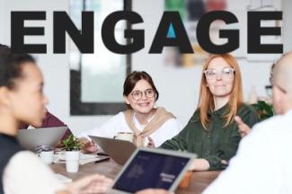 group of learners sitting around a table with the word engage in block letters